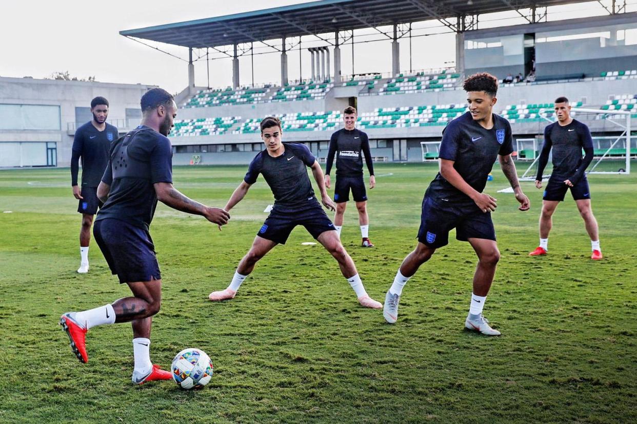 In the pink: Harry Winks (centre) training with England ahead of Monday's match against Spain in Seville: Eddie Keogh for The FA/REX/Shutt