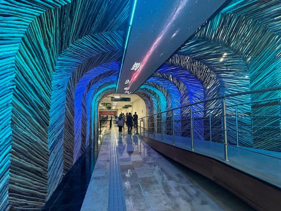 Lit-up tunnel to baggage claim in Tulum airport