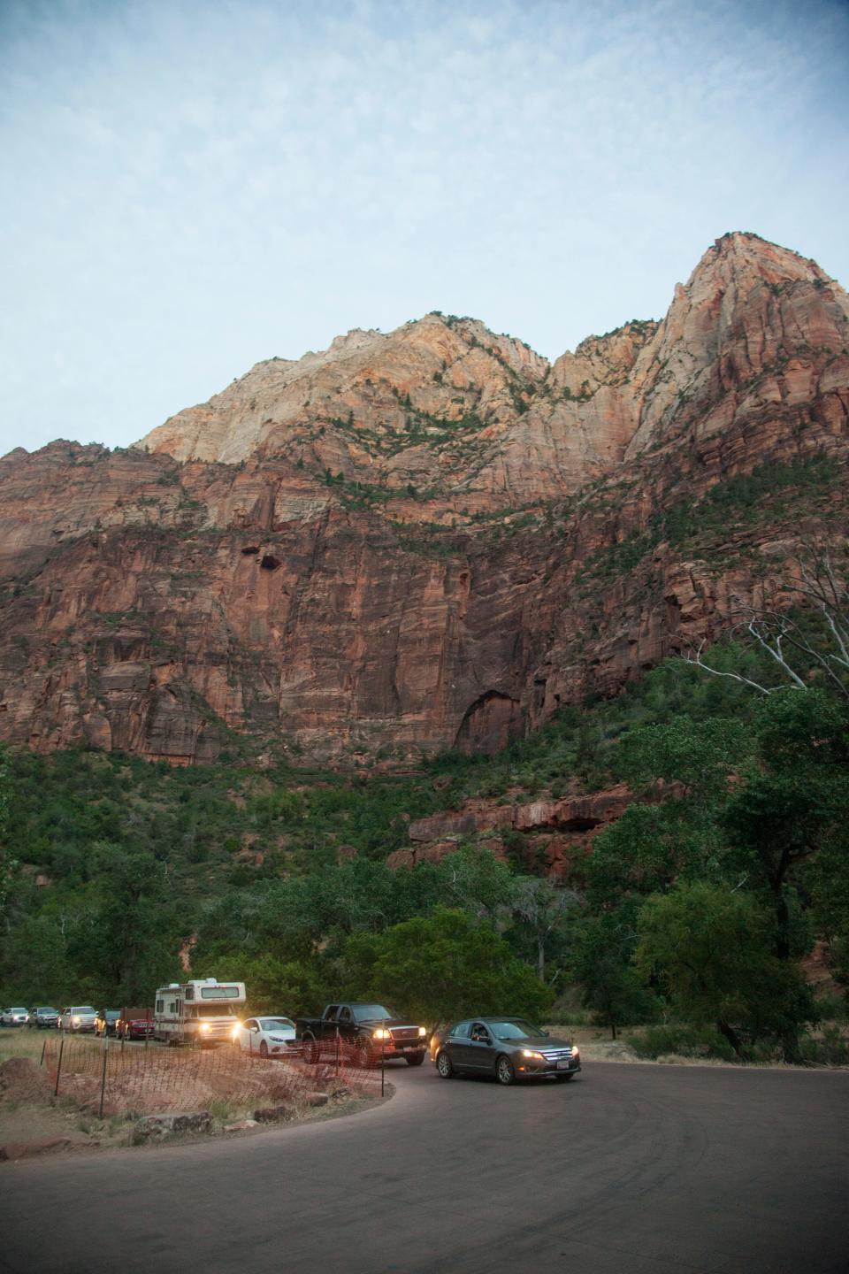 Hundreds of cars line up in Zion National Park on June 25 in hopes of getting a parking spot at one of the popular trailheads.