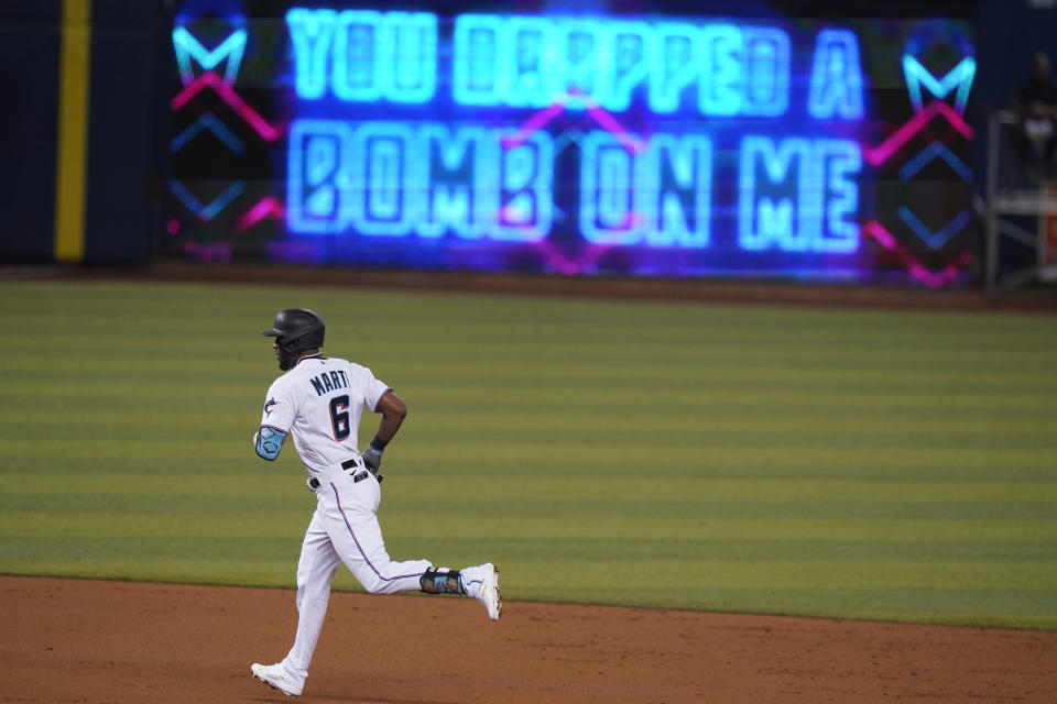 Miami Marlins' Starling Marte rounds second base after hitting a home-run during the second inning of a baseball game against the Colorado Rockies, Thursday, June 10, 2021, in Miami. (AP Photo/Wilfredo Lee)