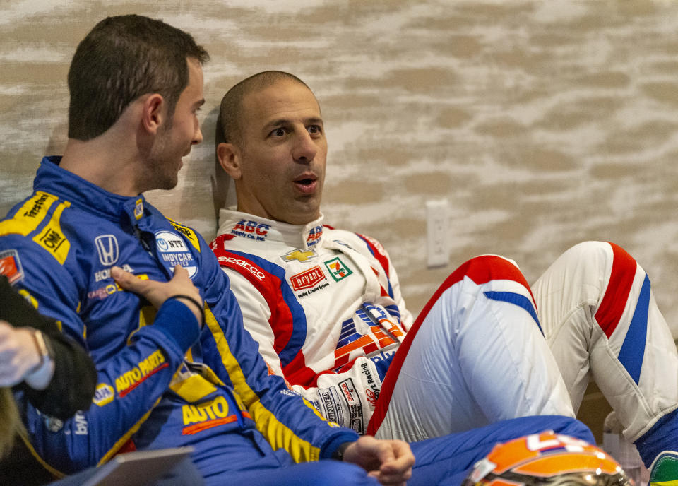 IndyCar driver Alexander Rossi, left, speaks with fellow driver Tony Kanaan between interviews during IndyCar auto racing media day, Monday, Feb. 11, 2019, in Austin, Texas. (AP Photo/Stephen Spillman)