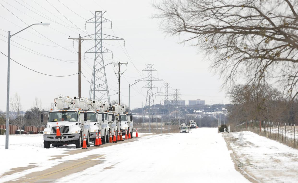 <span class="caption">Electric service trucks line up after a snow storm in Fort Worth, Texas, on Feb. 16, 2021.</span> <span class="attribution"><a class="link " href="https://www.gettyimages.com/detail/news-photo/pike-electric-service-trucks-line-up-after-a-snow-storm-on-news-photo/1231205567?adppopup=true" rel="nofollow noopener" target="_blank" data-ylk="slk:Ron Jenkins/Getty Images;elm:context_link;itc:0;sec:content-canvas">Ron Jenkins/Getty Images</a></span>