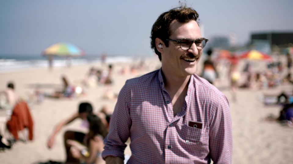 FILE - This file image provided by Warner Bros. Pictures shows Joaquin Phoenix in a scene from "Her." In “Her,” Spike Jonze’s futuristic exploration of a man’s relationship with his computer, the filmmaker surveys human disjunction. (AP Photo/Warner Bros. Pictures, File)