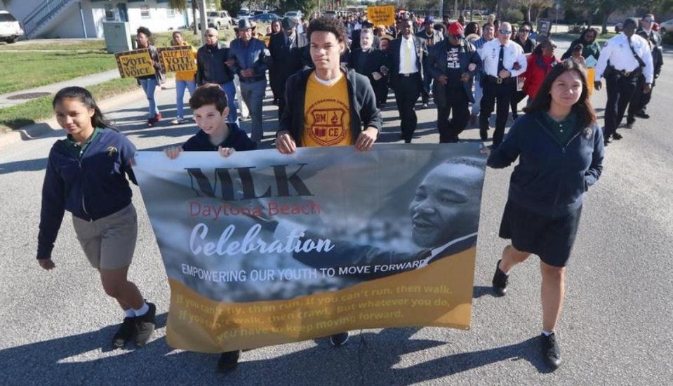 Marchers move along George Engram Boulevard on Monday, January 20, 2020 during the Martin Luther King Jr. Day parade in Daytona Beach.