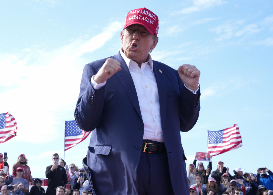 Republican presidential candidate former President Donald Trump gestures to the crowd at a campaign rally Saturday, March 16, 2024, in Vandalia, Ohio. (AP Photo/Jeff Dean)