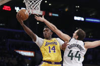 Los Angeles Lakers forward Stanley Johnson (14) goes to basket under pressure from Utah Jazz forward Bojan Bogdanovic (44) during the second half of an NBA basketball game in Los Angeles, Monday, Jan. 17, 2022. The Lakers won 101-95. (AP Photo/Ringo H.W. Chiu)