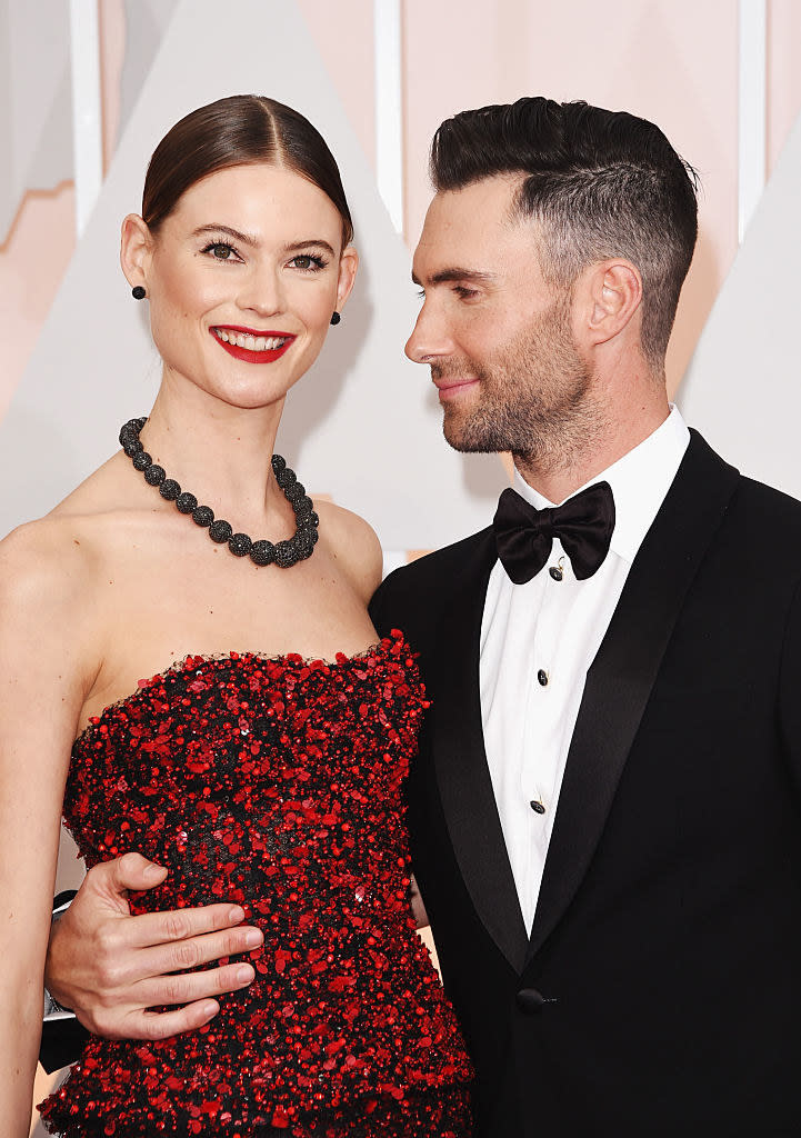 Adam with his arm around his wife