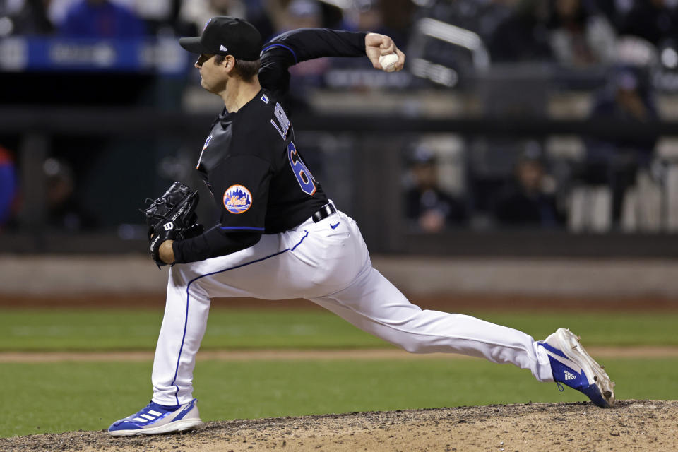 New York Mets pitcher Seth Lugo throws during the eighth inning of the team's baseball game against the Philadelphia Phillies on Friday, April 29, 2022, in New York. The Mets won 3-0 on a combined no-hitter. (AP Photo/Adam Hunger)