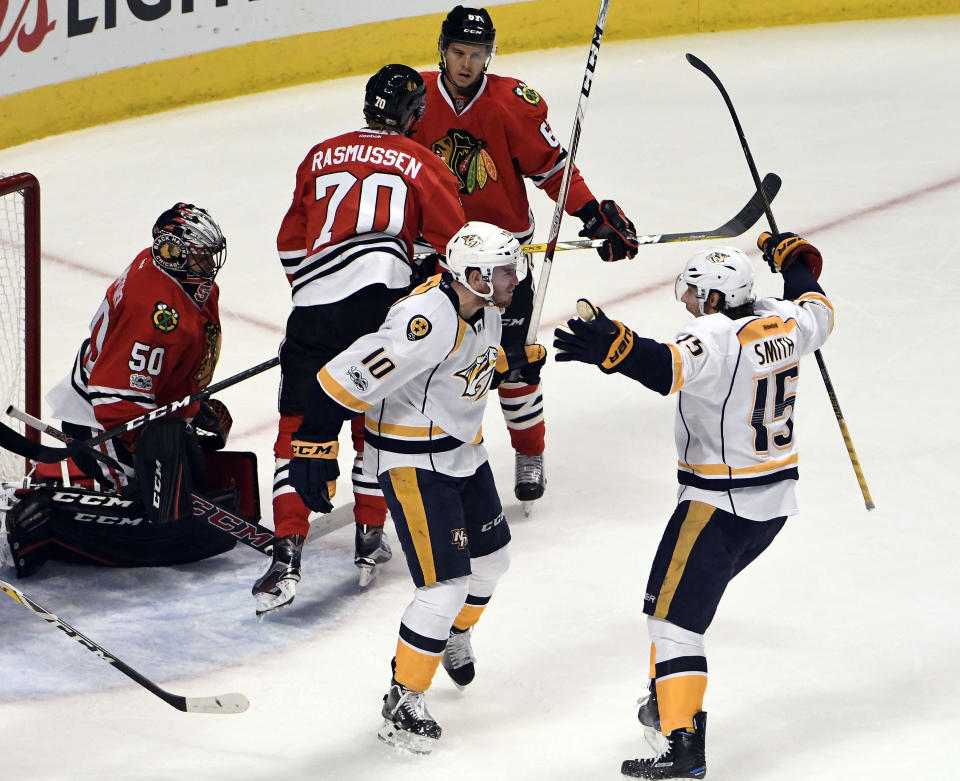 Nashville Predators center Colton Sissons (10) celebrates his goal against the Chicago Blackhawks with center Craig Smith (15) during the second period in Game 2 of a first-round NHL hockey playoff series, Saturday, April 15, 2017, in Chicago. (AP Photo/David Banks)