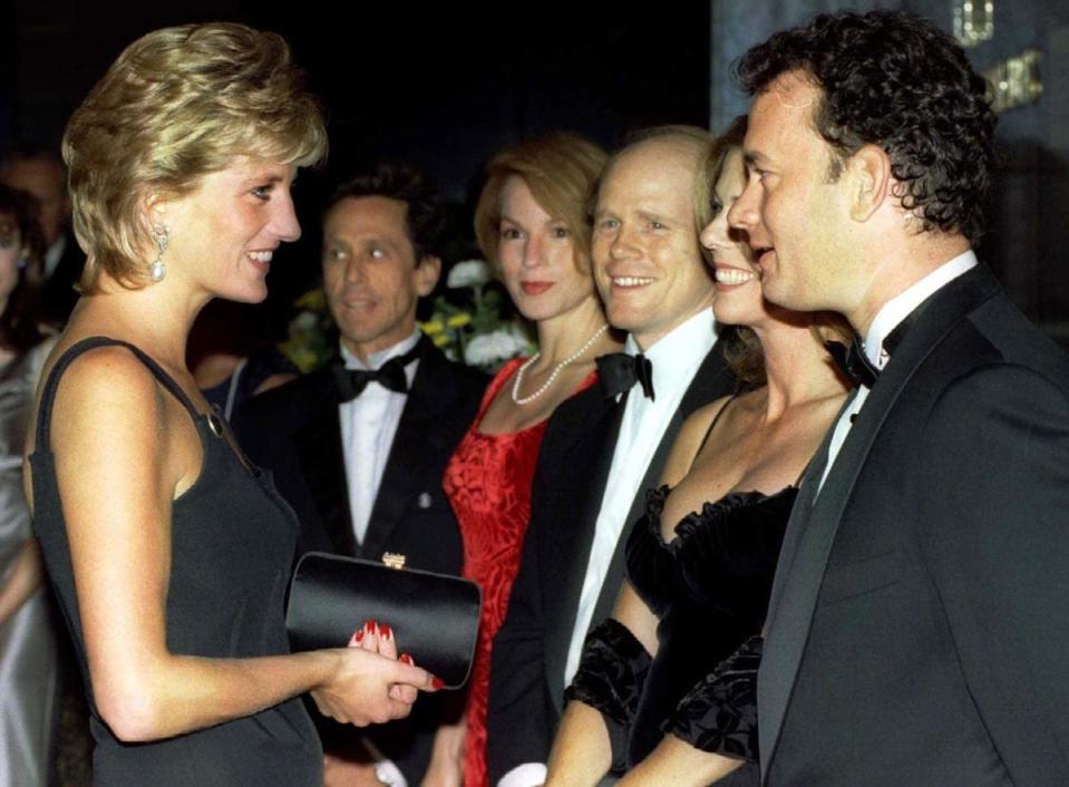 Diana speaks with actor Tom Hanks at the premiere of Apollo 13 in September 1995 [Photo: PA]