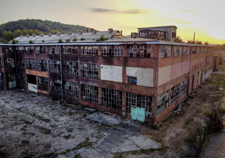 A wrecked and abandoned production building of the former East German VEB car factory where BMW and Wartburg cars were built is seen in Eisenach, eastern Germany, Tuesday, Sept. 22, 2020. The factory was closed in 1991. GThirty years after Germany was reunited on Oct. 3, 1990, many once-decrepit city centers in the formerly communist east have been painstakingly restored and new factories have sprung up. But many companies and facilities didn't survive the abrupt transition to capitalism inefficient companies found themselves struggling to compete in a market economy, while demand for eastern products slumped and outdated facilities were shut down. (AP Photo/Michael Probst)