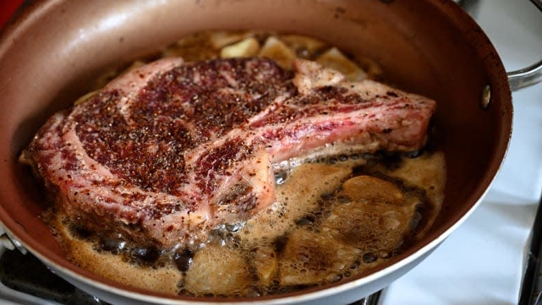 Steak is cooked in a saute pan.