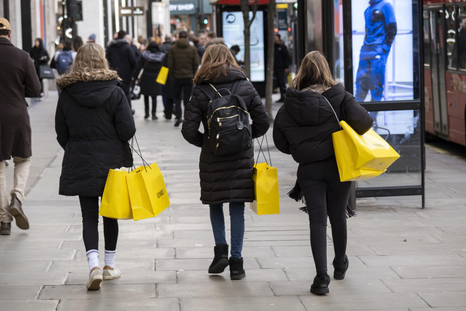 Shoppers with yellow Selfridges shopping bags out on Oxford Street on 9th January 2023 in London, United Kingdom. Oxford Street is a major retail centre in the West End of the capital and is Europes busiest shopping street with around half a million daily visitors to its approximately 300 shops, the majority of which are fashion and high street clothing stores. (photo by Mike Kemp/In Pictures via Getty Images)