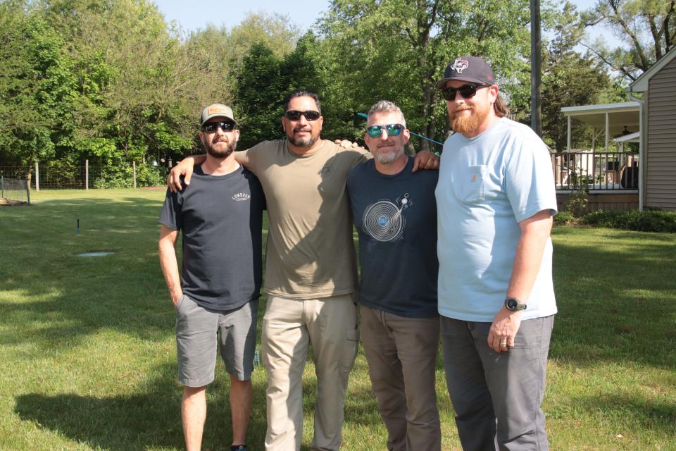 Army veteran and Adrian High School graduate Eric Espinoza, second from left, is pictured May 18, with three of his Army friends. From left, Garrett Kuhn of Adrian, Jon Fink of Hampstead, N.C., and Carl Beuermann of Kempner, Texas, were helping get Espinoza's father's house in Raisin Township ready to sell. Eric also lives in Texas.