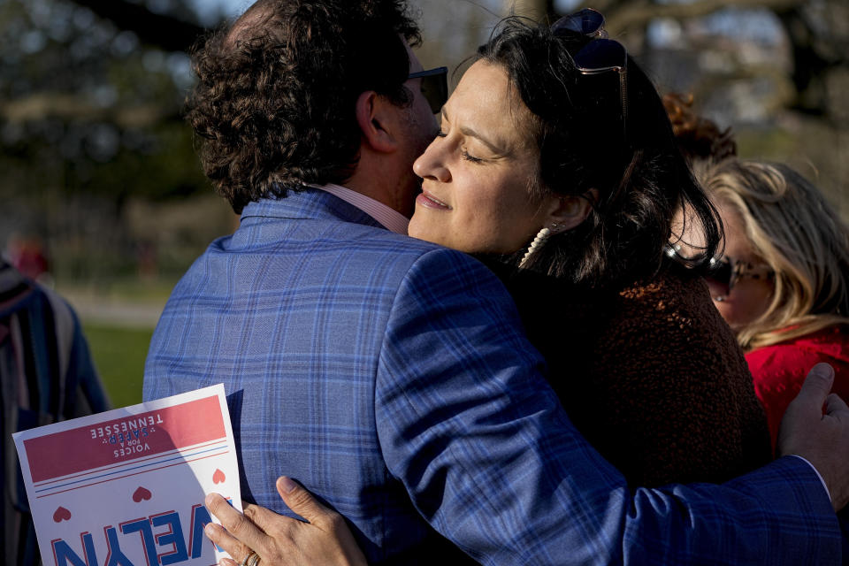 Katy Dieckhaus, right, mother of Evelyn Dieckhaus a victim in the Covenant School shooting receives a hug after the Linking Arms for Change human chain Wednesday, March 27, 2024, in Nashville, Tenn. The event was to commemorate the one-year anniversary of the incident where three students and three adults were killed by a shooter. (AP Photo/George Walker IV)