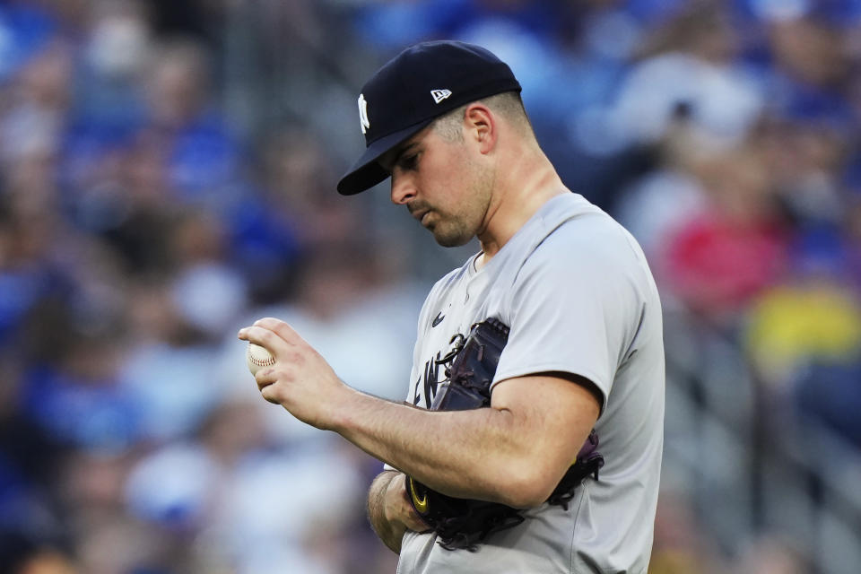 New York Yankees pitcher Carlos Rodon checks his grip during the second inning of a baseball game against the Toronto Blue Jays on Thursday, June 27, 2024, in Toronto. (Frank Gunn/The Canadian Press via AP)