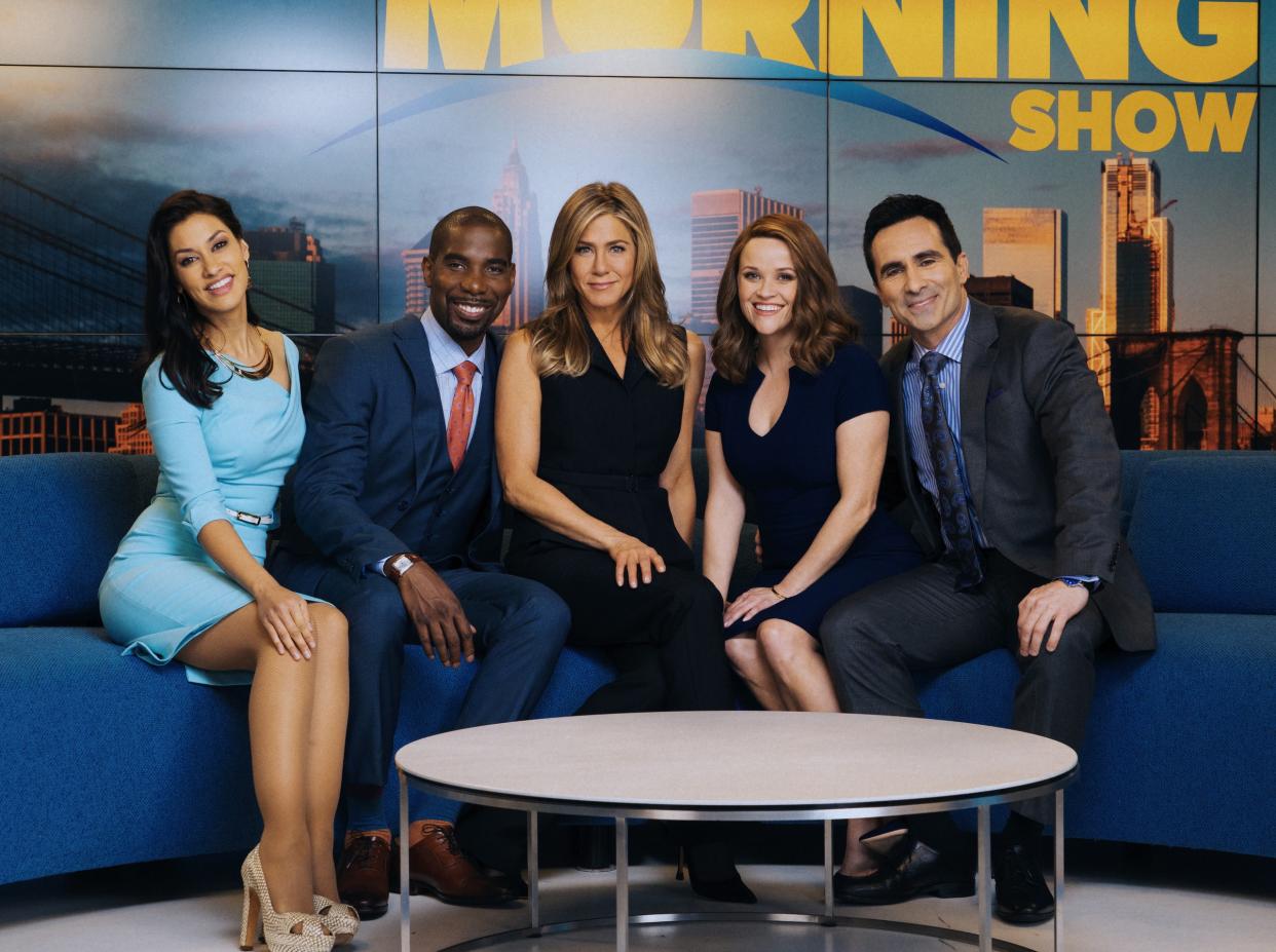 Janina Gavankar, left, poses with Desean Terry, Jennifer Aniston, Reese Witherspoon and Nestor Carbonell in 