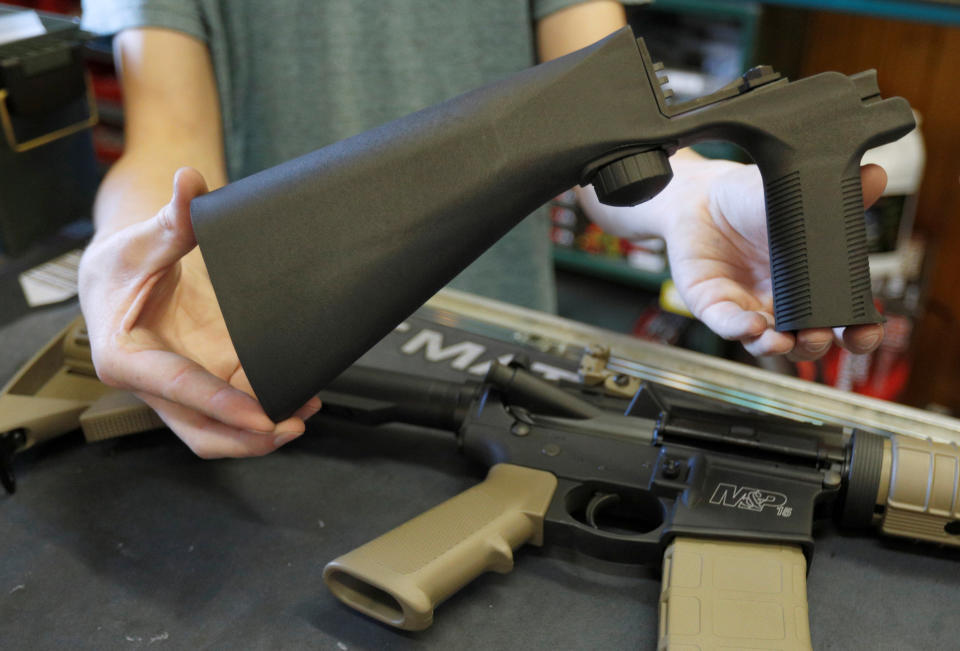 A bump stock, shown here in a Utah gun shop in October 2017, attaches to a semi-automatic rifle to increase its firing rate. (Photo: George Frey / Reuters)