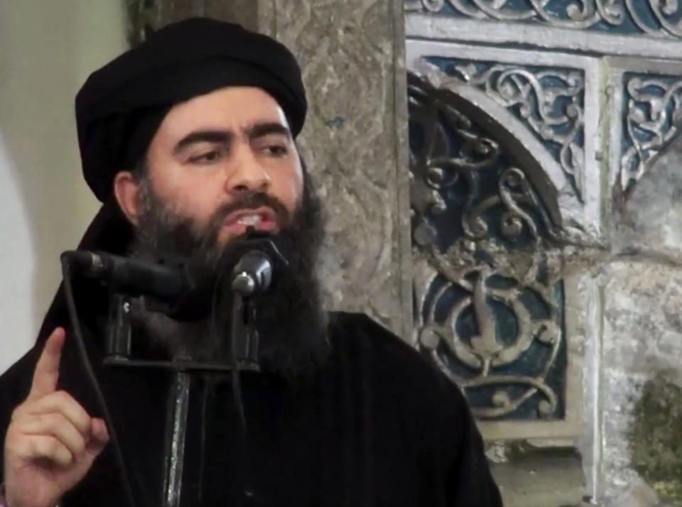 FILE - This image made from video posted on a militant website July 5, 2014, purports to show the leader of the Islamic State group, Abu Bakr al-Baghdadi, delivering a sermon at a mosque in Iraq during his first public appearance. President Donald Trump declared victory over the Islamic State group in Syria in a tweet Thursday, Dec. 20, 2018, but the militants remain a deadly force, and U.S. partners warn a premature U.S. withdrawal will allow them to storm back. The jihadists still hold territory in Syria and top leaders, including the group’s self-styled caliph Abu Bakr al-Baghdadi, remain at large. (Militant video via AP, File)