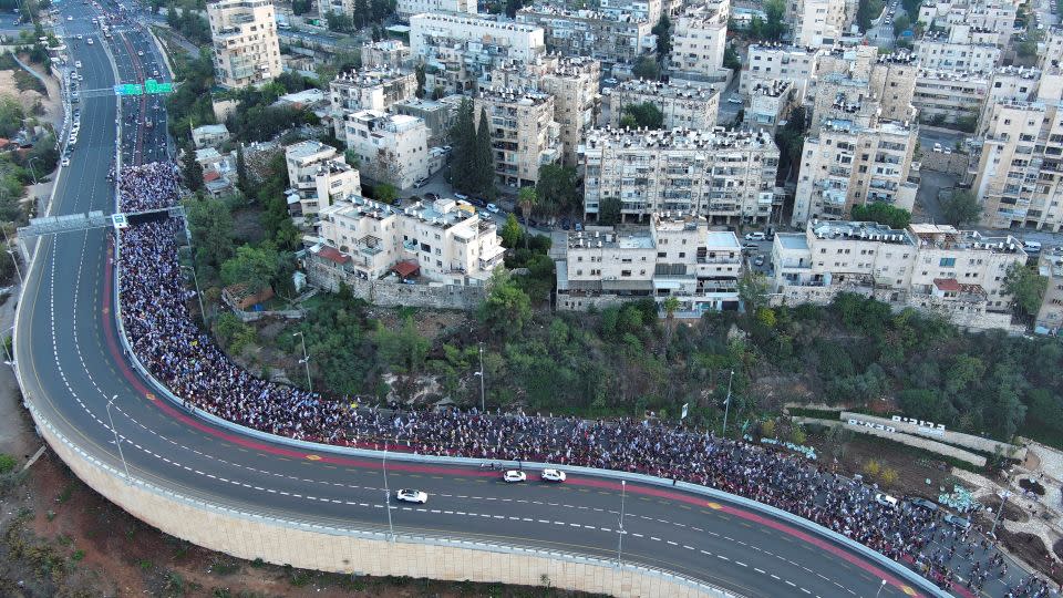 Family members, friends and supporters of Israelis and other nationalities who were taken hostage on October 7 by Palestinian Islamist group Hamas, complete their march into Jerusalem, November 18, 2023. - Ilan Rosenberg/Reuters