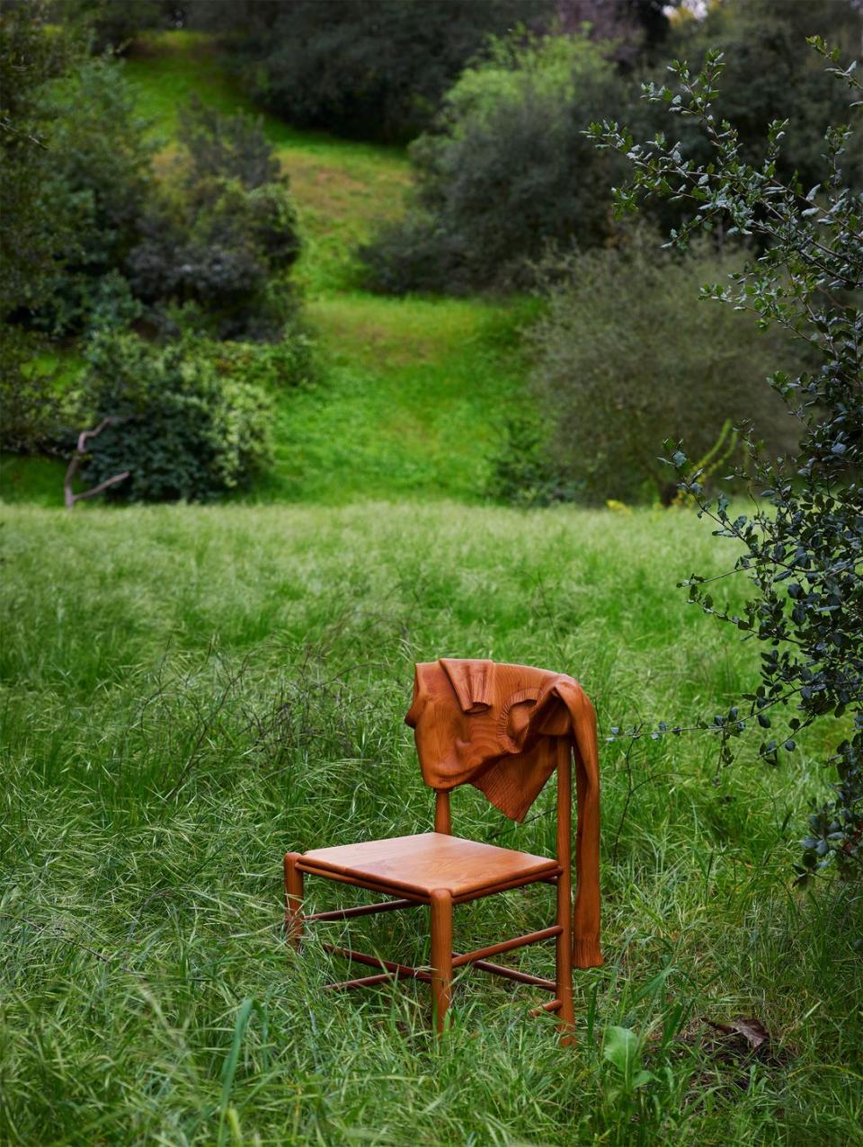 a chair in a grassy area