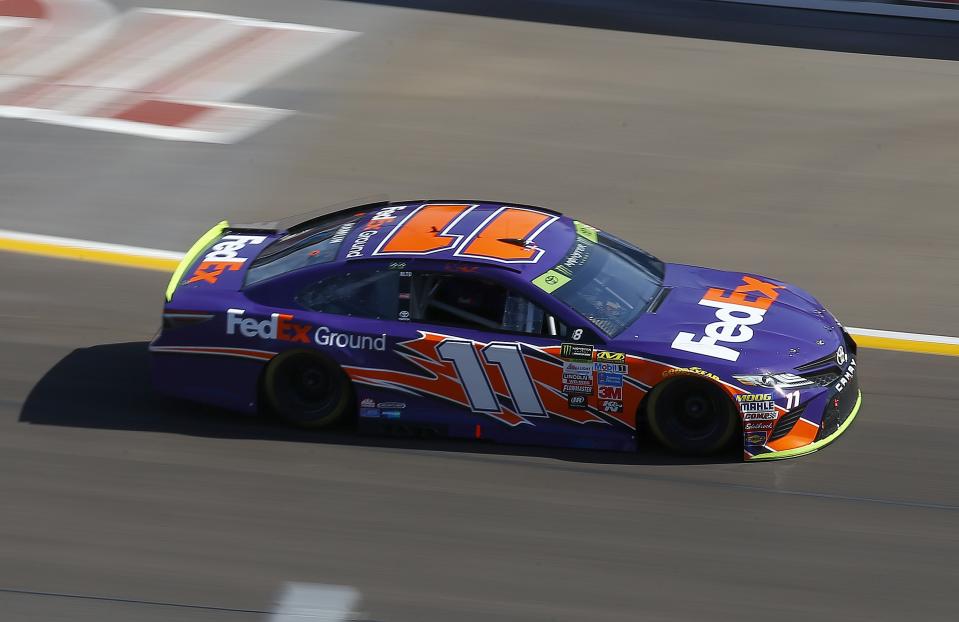 Denny Hamlin (11) leads early during a NASCAR Cup Series auto race at Phoenix International Raceway Sunday, Nov. 12, 2017, in Avondale, Ariz. (AP Photo/Ross D. Franklin)