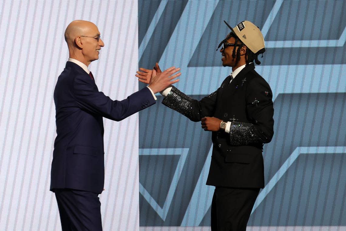 Rob Dillingham talks with NBA commissioner Adam Silver after being selected in the first round of the 2024 NBA draft at Barclays Center in New York.