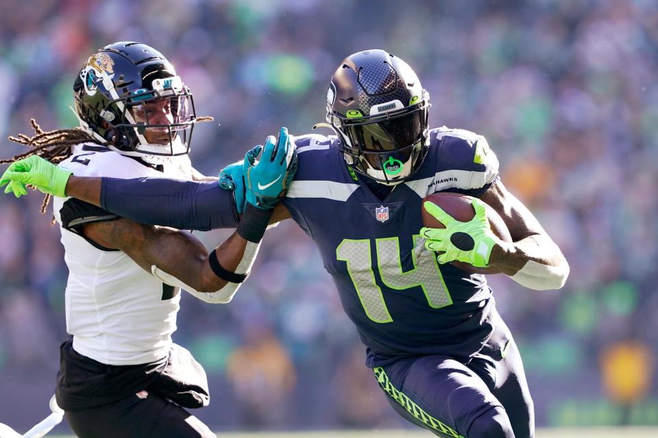 FILE - Seattle Seahawks' DK Metcalf (14) pushes off of Jacksonville Jaguars' Rayshawn Jenkins as he runs with the ball during the first half of an NFL football game, Sunday, Oct. 31, 2021, in Seattle. The Seahawks are embarking on the most important draft in a decade. (AP Photo/Ted S. Warren, File)