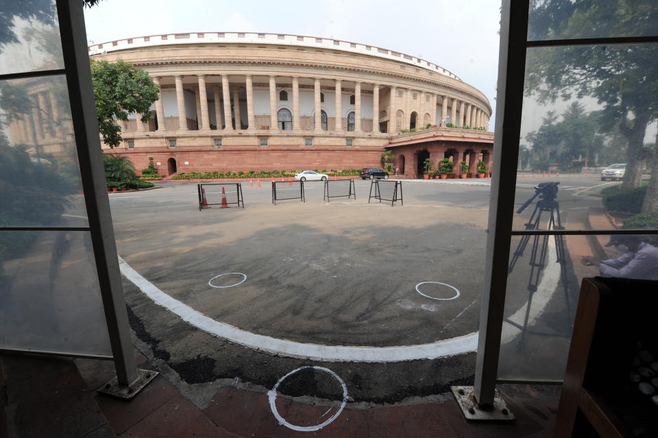 Markings to maintain physical distancing are seen on the ground outside the Parliament building in New Delhi, India, Monday, Sept.14, 2020. Indian lawmakers have returned to Parliament after more than five months even as coronavirus cases continue to surge at the fastest pace than anywhere else in the world. (AP Photo)