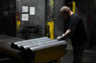 A steel worker inspects 155 mm M795 artillery projectiles during the manufacturing process at the Scranton Army Ammunition Plant, Tuesday, Aug. 27, 2024, in Scranton, Pa. (AP Photo/Matt Slocum)