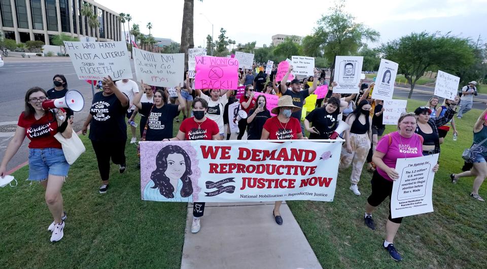 Thousands of protesters march around the Arizona Capitol in protest after the Supreme Court decision to overturn the landmark Roe v. Wade abortion decision Friday, June 24, 2022, in Phoenix. The Supreme Court on Friday stripped away women’s constitutional protections for abortion, a fundamental and deeply personal change for Americans' lives after nearly a half-century under Roe v. Wade. The court’s overturning of the landmark court ruling is likely to lead to abortion bans in roughly half the states. (AP Photo/Ross D. Franklin)