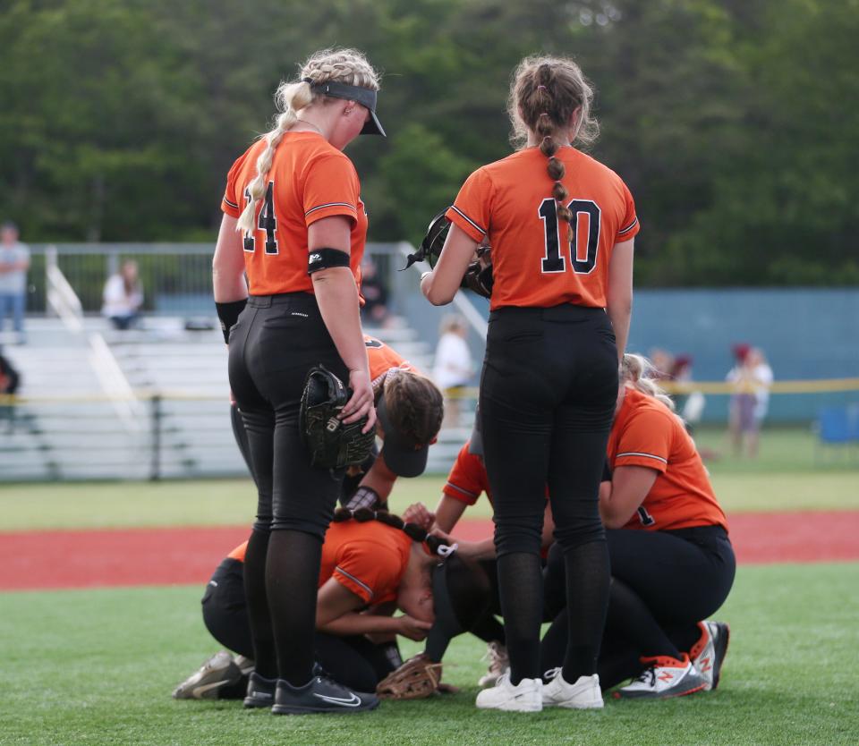 Wellsville softball players console each other after falling to Marlboro in the New York State Softball Championship semifinal on June 9, 2023. 