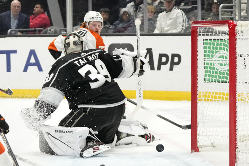 Philadelphia Flyers right wing Owen Tippett, top, scores on Los Angeles Kings goaltender Cam Talbot during the first period of an NHL hockey game Saturday, Nov. 11, 2023, in Los Angeles. (AP Photo/Mark J. Terrill)