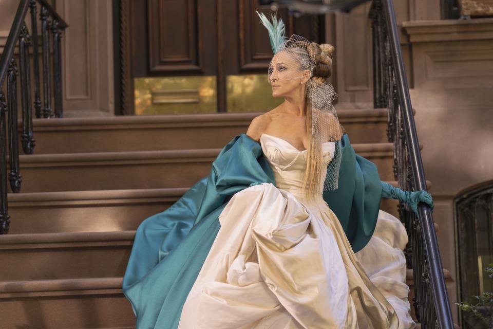 <span class="caption">Sarah Jessica Parker as Carrie Bradshaw re-wearing her famous Vivienne Westwood wedding dress</span><span class="photo-credit">Craig Blankenhorn</span>