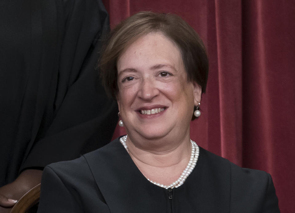 FILE - Associate Justice Elena Kagan joins other members of the Supreme Court as they pose for a new group portrait, at the Supreme Court building in Washington, Oct. 7, 2022. Kagan said Friday, Oct. 21, that “time will tell” whether the Supreme Court can get back to “finding common ground” after a term in which the court's six conservatives and three liberals split over major issues including abortion and gun rights. (AP Photo/J. Scott Applewhite, File)