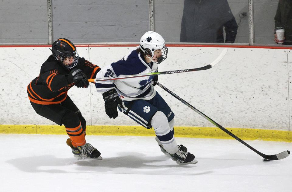 Churchville-Chili’s Sam Herring pressures Pittsford’s Keegan Garver.