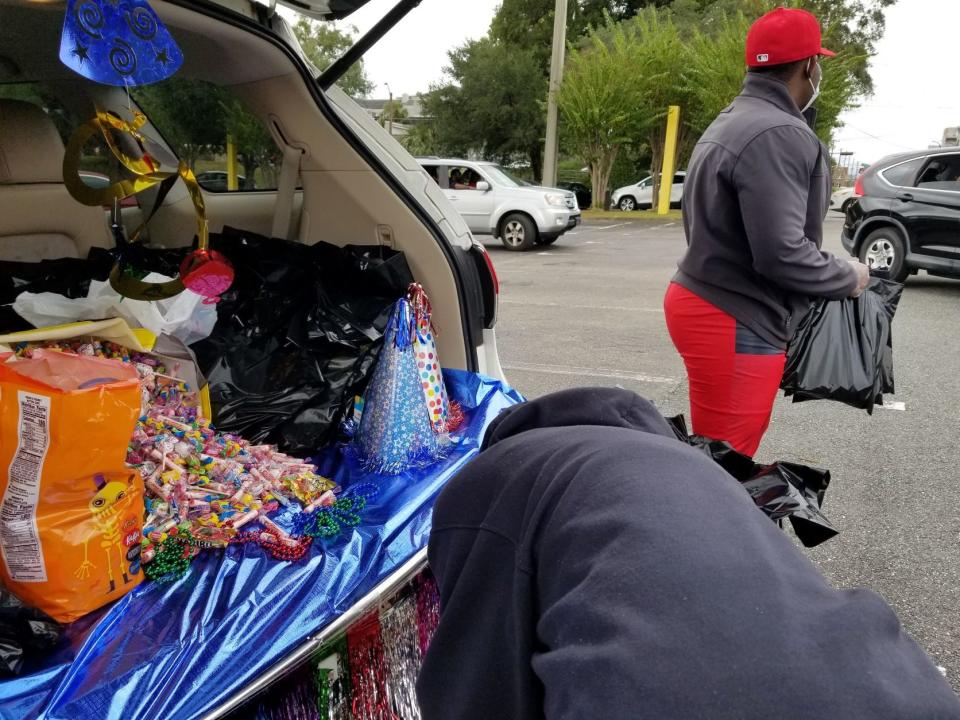Mission Possible Enrichment Center members participate in trunk or treat. Seeing no community center serving their Tharpe Street neighborhood, the church opens its doors as a community hub.
