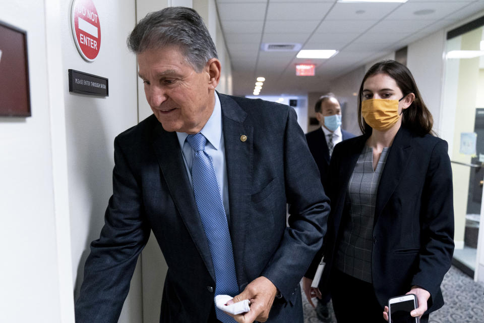 Sen. Joe Manchin, D-W.Va., a key holdout vote on President Joe Biden's domestic agenda, walks into his office on Capitol Hill in Washington, Wednesday, Oct. 27, 2021. (AP Photo/Andrew Harnik)