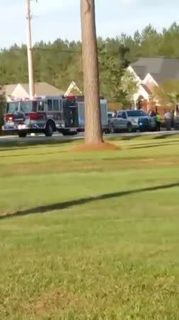 Emergency personnel are seen on site in the aftermath of a shooting in Florence, South Carolina, U.S. October 3, 2018, in this still image obtained from a social media video. Derek Lowe/via REUTERS