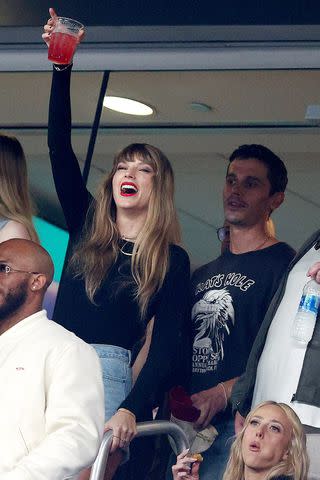 <p>Elsa/Getty</p> Taylor Swift and Antoni Porowski cheer prior to the game between the Kansas City Chiefs and the New York Jets at MetLife Stadium on October 01, 2023 in East Rutherford, New Jersey.