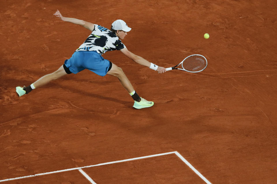 Italy's Jannik Sinner plays a shot against Belgium's David Goffin in the first round match of the French Open tennis tournament at the Roland Garros stadium in Paris, France, Sunday, Sept. 27, 2020. (AP Photo/Christophe Ena)