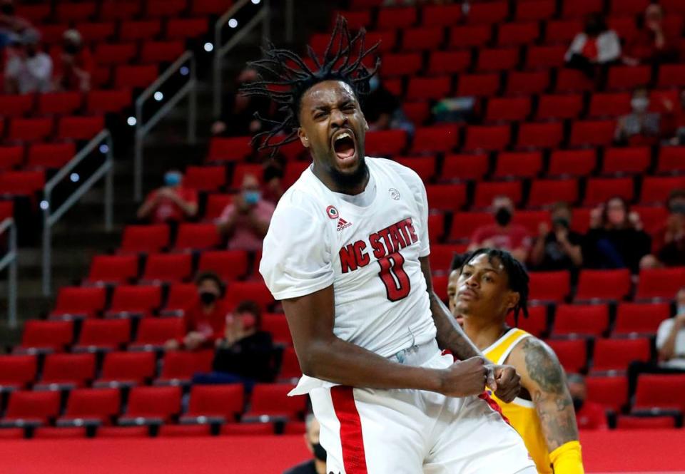 N.C. State’s D.J. Funderburk (0) celebrates after slamming in two during the second half of N.C. State’s 65-62 victory over Pittsburgh at PNC Arena in Raleigh, N.C., Sunday, February 28, 2021.