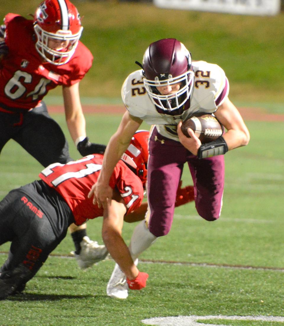 Hayden Allard looks for some running room against New Canaan during the Class L quarterfinals Tuesday at Dunning Field.