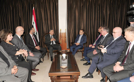 Syria's Minister of National Reconciliation Affairs Ali Haidar meets with members of the far-right Alternative for Germany (AfD) in Syria March 6, 2018. SANA/Handout via REUTERS