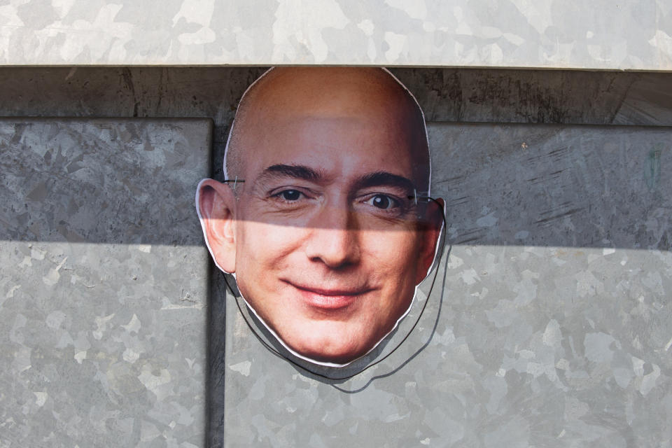 SAN FERNANDO DE HENARES, SPAIN - 2018/07/16: Mask of Jeff Bezos, owner of Amazon, seen during the strike. The works council called a three-day strike after a meeting without any agreement in which the company has made gestures, but has not agreed to the main demands of the workers. They are striking during the "Prime Day", a 36-hour discount campaign which is expected to be one of the busiest time for Amazon and the strike will cause huge disruption. (Photo by Lito Lizana/SOPA Images/LightRocket via Getty Images)