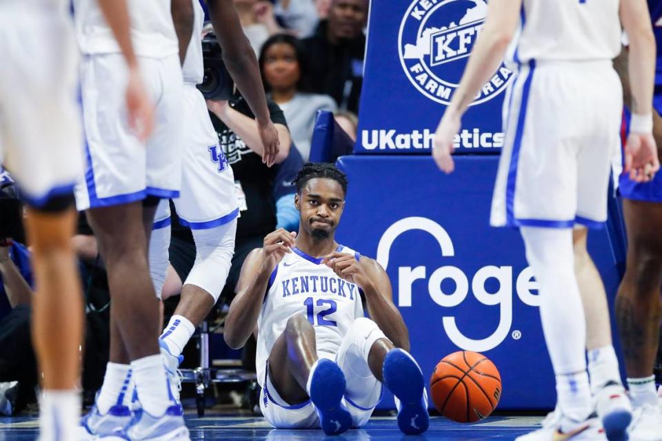 Kentucky guard Antonio Reeves (12) reacts after being called for a foul against Kansas during Saturday’s game at Rupp Arena.