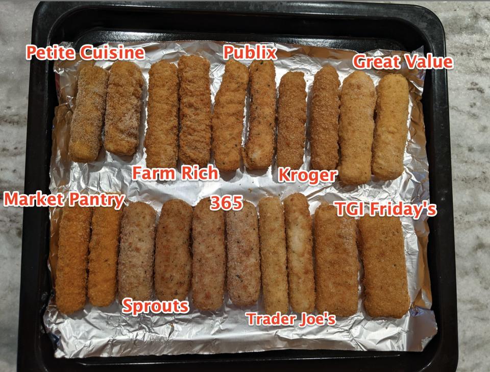 Mozarella sticks on a foil-lined tray