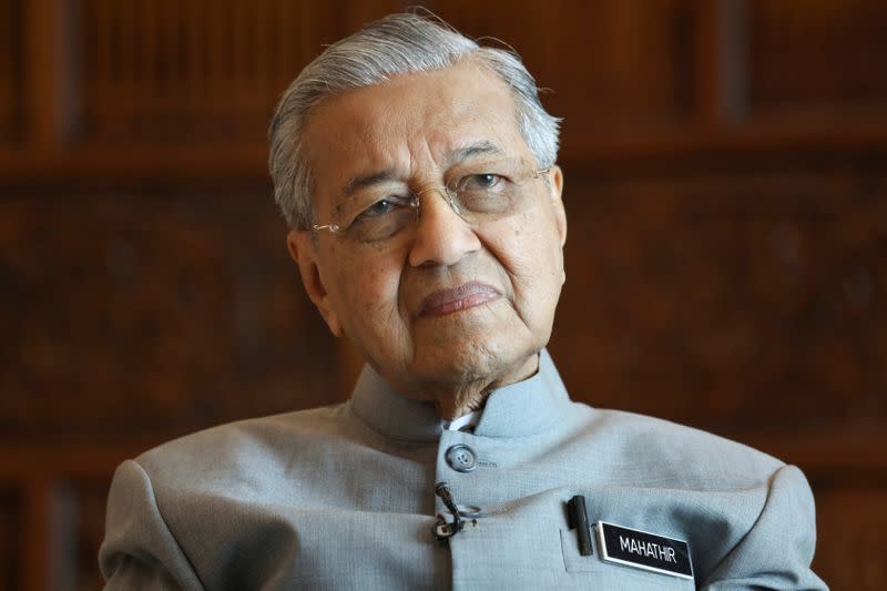 Malaysia's Prime Minister Mahathir Mohamad looks on during an interview with Reuters in Putrajaya