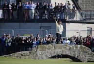 Nick Faldo of England poses on The Swilcan Bridge on the 18th hole during the second round of the British Open golf championship on the Old Course in St. Andrews, Scotland, July 17, 2015. Faldo is playing in his last Open golf championship at St. Andrews. REUTERS/Paul Childs