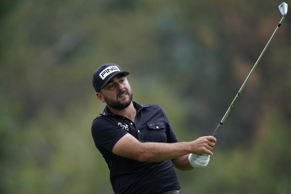 Stephen Jaeger drives from the 9th tee during the first round of the Rocket Mortgage Classic golf tournament, Thursday, July 28, 2022, in Detroit. (AP Photo/Carlos Osorio)